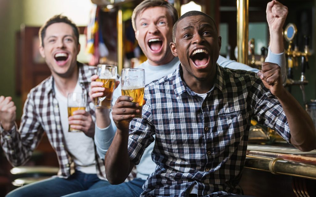 Three men at a sports bar