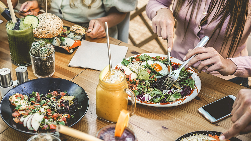 Young restaurant guests eating brunch