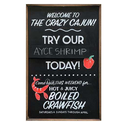 Restaurant chalkboard art sign introducing guests to 'The Crazy Cajun'