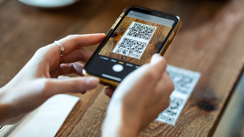 A smartphone scanning in a QR code to get a restaurant's digital menu