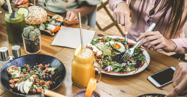 Young restaurant guests eating brunch